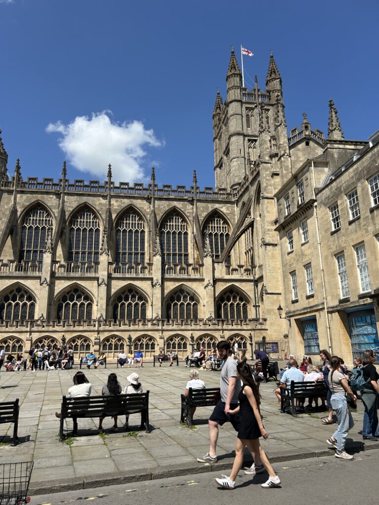 Waiting for the Bath Rugby victory parade while wandering around downtown Bath and drinking Bath craft beer.