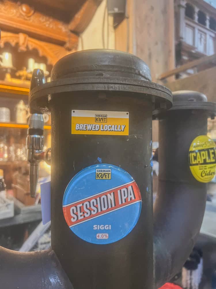 Brewed locally German Költ Session IPA beer tap handle at a craft beer bar or brewery.